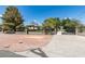 Front view of house with gated entrance and landscaping at 1860 E Ford Ave, Las Vegas, NV 89123