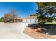 Three-car garage and expansive driveway at 1860 E Ford Ave, Las Vegas, NV 89123