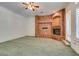 Gathering room features a brick fireplace and carpet flooring at 1860 E Ford Ave, Las Vegas, NV 89123