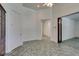 Spacious hallway with tile flooring and access to other rooms at 1860 E Ford Ave, Las Vegas, NV 89123