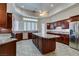 Kitchen boasts granite counters and wood cabinetry at 1860 E Ford Ave, Las Vegas, NV 89123