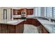 Gourmet kitchen with granite counters and wood cabinets at 1860 E Ford Ave, Las Vegas, NV 89123