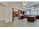 Spacious kitchen with island, granite countertops, and dark wood cabinetry at 1860 E Ford Ave, Las Vegas, NV 89123