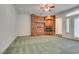 Living room featuring a corner brick fireplace at 1860 E Ford Ave, Las Vegas, NV 89123