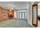 Bright living room with brick fireplace and French doors at 1860 E Ford Ave, Las Vegas, NV 89123