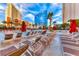 Inviting pool area with ample lounge chairs and red umbrellas at 145 E Harmon Ave # 1121, Las Vegas, NV 89109