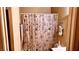Bathroom with shower/tub combo and patterned shower curtain at 5860 Medallion Dr # 202, Las Vegas, NV 89122
