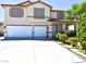 Two-story house with a two-car garage and landscaped front yard at 7917 Sally Irene Ct, Las Vegas, NV 89113