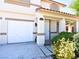 Two-story house with a white garage door and entryway at 7917 Sally Irene Ct, Las Vegas, NV 89113