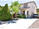 Two-story house with a driveway and lush landscaping at 7917 Sally Irene Ct, Las Vegas, NV 89113