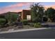 Modern home with desert landscaping at sunset at 10057 Regency Canyon Way, Las Vegas, NV 89148