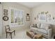 Cozy sitting room with comfy sofa and large window with plantation shutters at 10057 Regency Canyon Way, Las Vegas, NV 89148