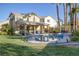 Beautiful backyard with a private pool, patio area, and lush green lawn at 1002 Prestige Meadows Pl, Henderson, NV 89052