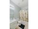 Bathroom showcasing a vanity with a white sink, a toilet, and a palm tree shower curtain at 1002 Prestige Meadows Pl, Henderson, NV 89052