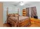 Traditional-style bedroom with a ceiling fan, wooden floors, and a comfortable bed at 1002 Prestige Meadows Pl, Henderson, NV 89052