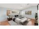 Bedroom featuring a large bed, windows, and wood flooring at 1002 Prestige Meadows Pl, Henderson, NV 89052