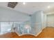 Hallway with railing, wood floor, and natural light at 1002 Prestige Meadows Pl, Henderson, NV 89052