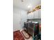 Neat laundry room includes front load washer and dryer, white cabinets, and tile flooring at 1002 Prestige Meadows Pl, Henderson, NV 89052