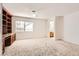 Bedroom with built-in shelves and adjacent bathroom at 7668 Gossamer Wind St, Las Vegas, NV 89139