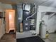 A utility room with a hot water tank, furnace, and a doorway at 841 Lusterview Ct, Las Vegas, NV 89123