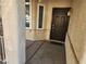 Dark brown front door with sidelights and a small welcome mat at 841 Lusterview Ct, Las Vegas, NV 89123