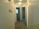 Hallway with neutral paint and carpet leads to bedrooms at 841 Lusterview Ct, Las Vegas, NV 89123