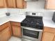 Kitchen features stainless steel oven, light wood cabinetry and white countertops at 841 Lusterview Ct, Las Vegas, NV 89123