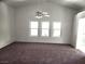 Living area features vaulted ceiling and large windows with lots of light at 841 Lusterview Ct, Las Vegas, NV 89123