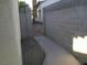 Narrow side yard featuring a secure gate, providing privacy and access to other areas at 841 Lusterview Ct, Las Vegas, NV 89123