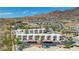 Aerial view of a community with multiple residential buildings, pool, and parking at 687 Marina Dr # 39, Boulder City, NV 89005