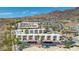 Aerial view showcasing a residential building, pool, and surrounding landscape at 687 Marina Dr # 39, Boulder City, NV 89005