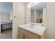 Bathroom with wood vanity and a view of the bedroom at 687 Marina Dr # 39, Boulder City, NV 89005