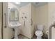 Small bathroom with pedestal sink and toilet at 687 Marina Dr # 39, Boulder City, NV 89005