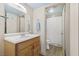 Well-lit bathroom with wood vanity and shower at 687 Marina Dr # 39, Boulder City, NV 89005