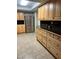 Modern kitchen featuring stainless steel refrigerator and ample wood cabinetry at 687 Marina Dr # 39, Boulder City, NV 89005