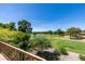 Serene balcony view of a beautiful golf course and pond at 7132 Mission Hills Dr, Las Vegas, NV 89113