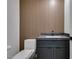 Stylish bathroom with modern vanity and wood-paneled accent wall at 7132 Mission Hills Dr, Las Vegas, NV 89113