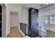 Bright hallway with modern metal accent wall and hardwood floors at 7132 Mission Hills Dr, Las Vegas, NV 89113