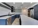 Modern kitchen with dark blue cabinetry, stainless steel appliances, and a large island at 7132 Mission Hills Dr, Las Vegas, NV 89113