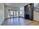 Light-filled living room featuring hardwood floors and a modern fireplace at 7132 Mission Hills Dr, Las Vegas, NV 89113