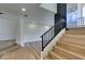 Modern staircase with metal railing and light wood steps at 7132 Mission Hills Dr, Las Vegas, NV 89113