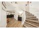 Bright foyer with hardwood floors, spiral staircase, and views of a comfortable seating area at 6391 Tempting Choice Ave, Las Vegas, NV 89131