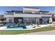 Expansive backyard boasts a large pool with in-water loungers, ample seating, and a sleek, modern design for outdoor living at 12 Oakmont Hills Ln, Las Vegas, NV 89141