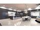 Open-concept kitchen featuring a large island, modern appliances, and adjacent dining area at 12 Oakmont Hills Ln, Las Vegas, NV 89141