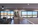 Upstairs living area with floor-to-ceiling windows offering stunning outdoor views and ample natural light at 12 Oakmont Hills Ln, Las Vegas, NV 89141
