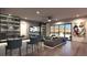 Stylish living area with a bar, comfortable seating, and panoramic views from large windows at 12 Oakmont Hills Ln, Las Vegas, NV 89141