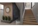 Staircase area featuring modern art and a custom mirror, creating a stylish focal point at 12 Oakmont Hills Ln, Las Vegas, NV 89141