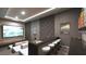 Home theater with tiered seating, bar, and a large projection screen for the ultimate viewing experience at 12 Oakmont Hills Ln, Las Vegas, NV 89141