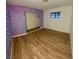 Bright bedroom with wood-look floors and painted wall at 1310 Fremont St, Pahrump, NV 89048