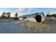 Ranch style home with solar panels and gravel driveway at 1310 Fremont St, Pahrump, NV 89048